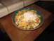 1990 Ford Bronco - A bowl of cereal with various ingredients sits on a wooden surface.