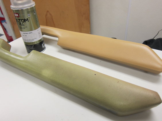 Two plastic interior door pull handles, one tan and one faded green, with a can of Custom Fill spray paint