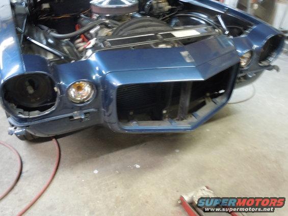Blue 1970 Chevrolet Camaro front end with hood open, missing driver's side headlight and grille