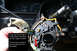 1987 Ford Bronco - Steering column switch assembly detail, showing copper buttons and wiring. The red arrow points to a sunk button.