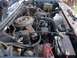 1985 Ford Bronco - Engine bay of a vehicle, showing various components and wiring.