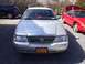 2005 Mercury Grand Marquis - Front view of a silver 2005 Mercury Grand Marquis, a red bow on the dashboard and a New York license plate.