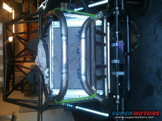 Off-road buggy chassis frame with radiator and exhaust pipes