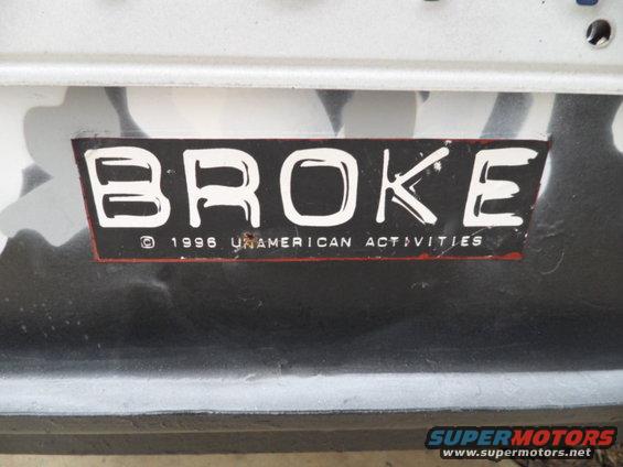 Sticker that says BROKE and 1996 UNAMERICAN ACTIVITIES