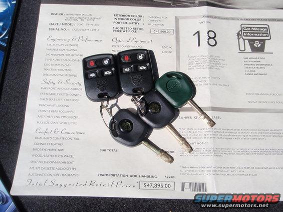 Car keys and window sticker for a 2000 Jaguar S-Type