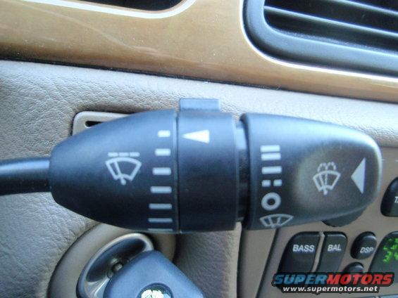 Close-up of a 2000 Jaguar S-Type windshield wiper stalk and dashboard controls