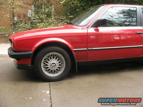 Red 1986 BMW 3 Series, front quarter view showing wheel and door