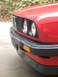 1986 BMW 3 Series - Close-up of the front grille and bumper of a red BMW 3 Series.
