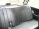 1986 BMW 3 Series - Interior view of a car's rear seat, showing the seat upholstery and seatbelts.