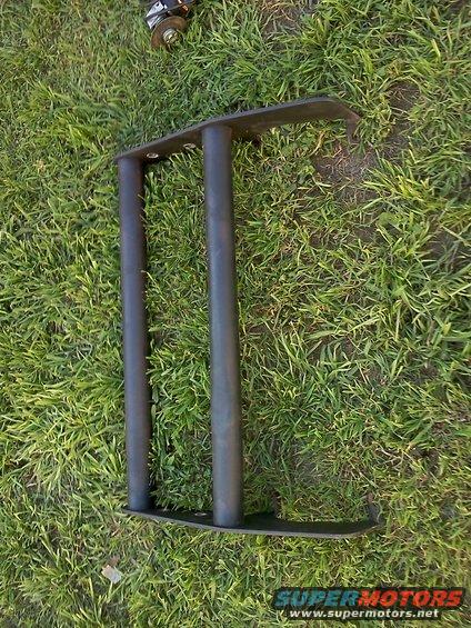 Black bull bar part on grass