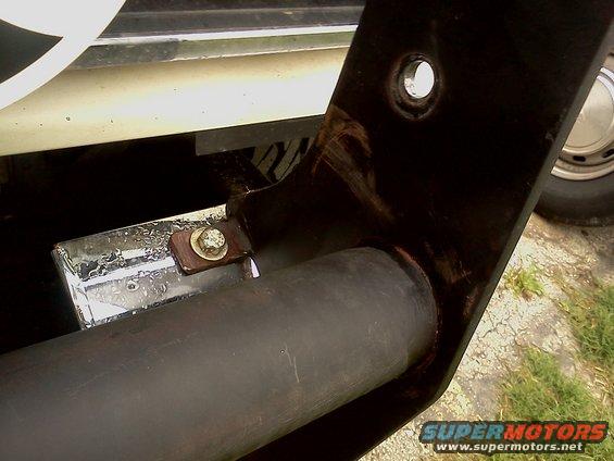 Bull bar mounting bracket on a vehicle with a chrome accent