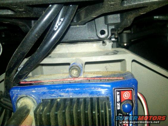 Blue electronic speed controller with black wires and a red button labeled EZ-SET