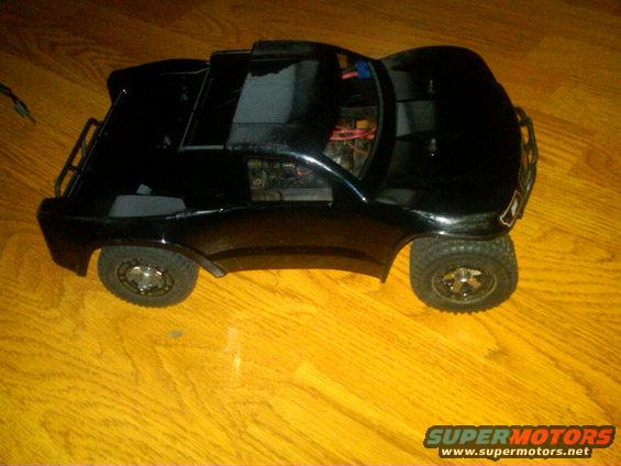 black remote control truck body on wooden floor