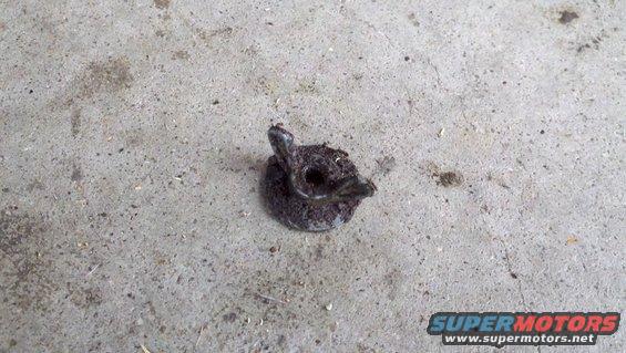 Dirty metal fastener on concrete