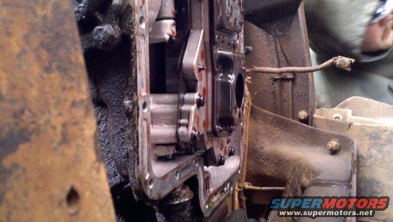 Transmission internals with red fluid visible, part of a vehicle repair