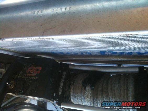 Smittybilt XRC winch mounted below a vehicle radiator