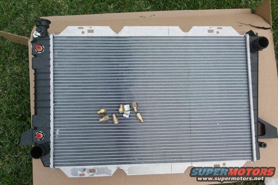 Radiator with brass fittings on a cardboard box