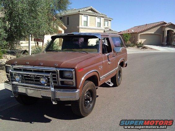 Brown 1981 Ford Bronco with chrome grille guard and visor