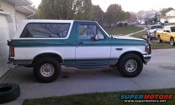 1996 Ford Bronco parked in driveway, side view