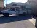 1997 Dodge 3500 - This 1997 Dodge 3500 pickup truck is equipped with a camper shell, seen from the side.