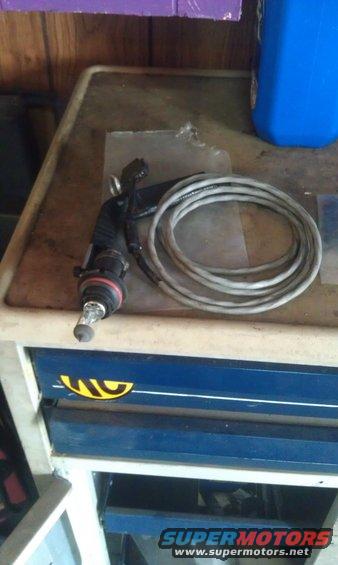 Headlight bulb and wire harness on workbench
