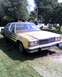 1985 Ford Crown Victoria LTD - This older sedan, possibly a Ford Crown Victoria from the early 1980s, is parked outdoors on a grassy area.