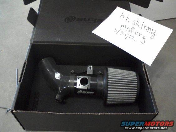 Cold air intake system in a box, with a handwritten note on top