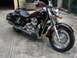 2006 Honda Shadow Aero - This motorcycle is parked on a concrete driveway in front of a garage.