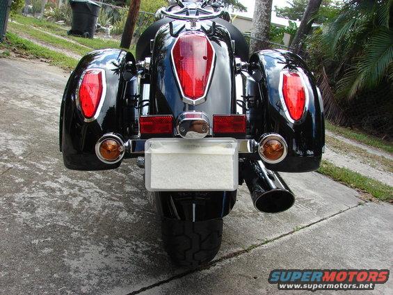 Black motorcycle rear view with saddlebags and chrome accents