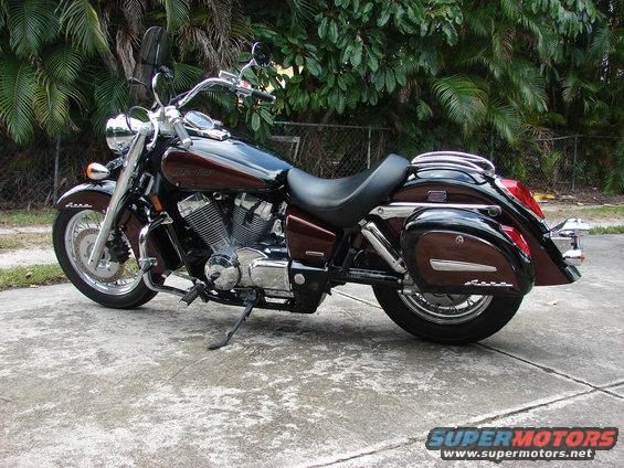 2006 Honda Shadow Aero motorcycle parked on concrete with palm trees in background
