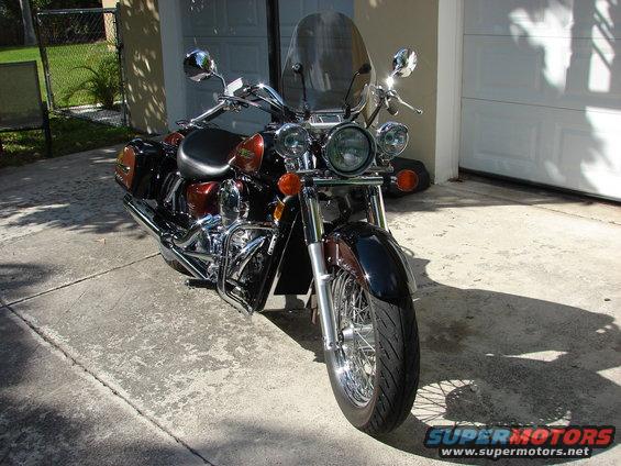 2006 Honda Shadow Aero motorcycle, dark red and black, parked in driveway