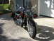 2006 Honda Shadow Aero - A 2006 Honda Shadow Aero motorcycle is parked in front of a garage door.