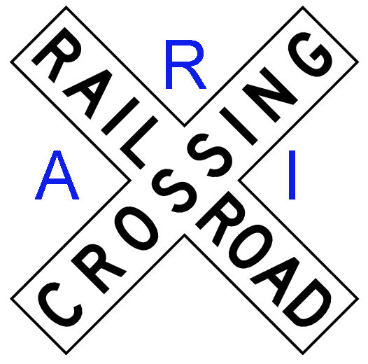Railroad crossing sign with text RAILS CROSSING