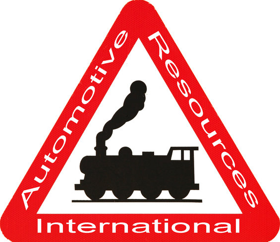 Red triangle warning sign with black train silhouette and text 'Automotive Resources International'