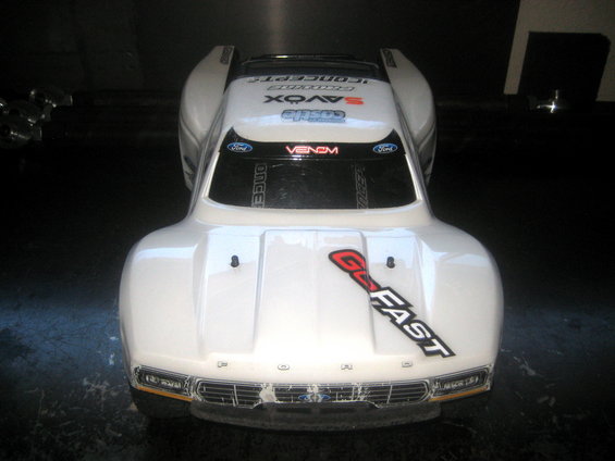 White RC car body with 'GO FAST' decal and Ford logo on grille