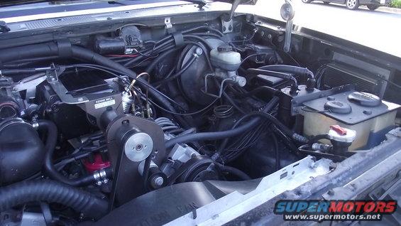 Engine bay with supercharger and oil catch can installed