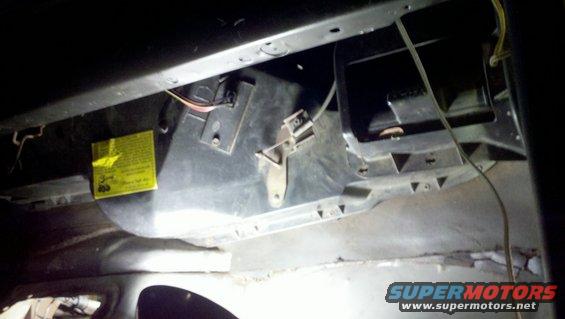 HVAC blower motor housing with yellow warning sticker