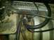 1987 Ford Bronco - Close-up of a Ford electronic fuel injection manifold, showing hoses and throttle cable assembly.