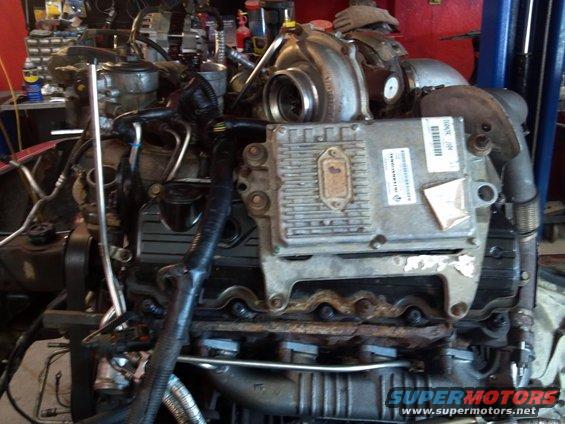Close-up of a diesel engine, showing the turbocharger and electronic control module