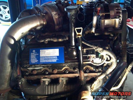 Engine with turbocharger and blue information sticker