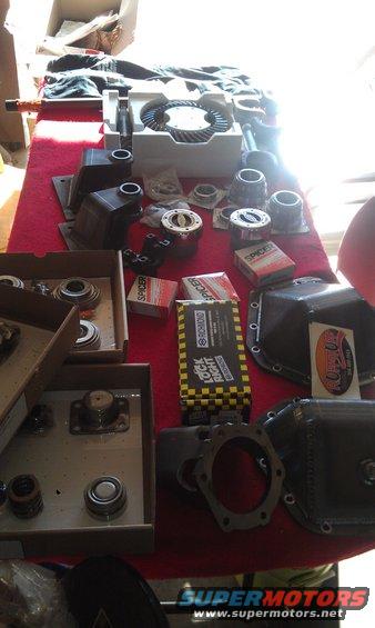 Dana 60 differential parts including ring gear, bearings, and Spicer boxes