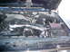 1992 Ford Bronco - The engine bay of a vehicle, showing the air intake system and engine components.