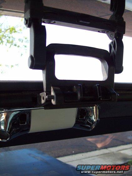 Sunroof latch mechanism with chrome trim