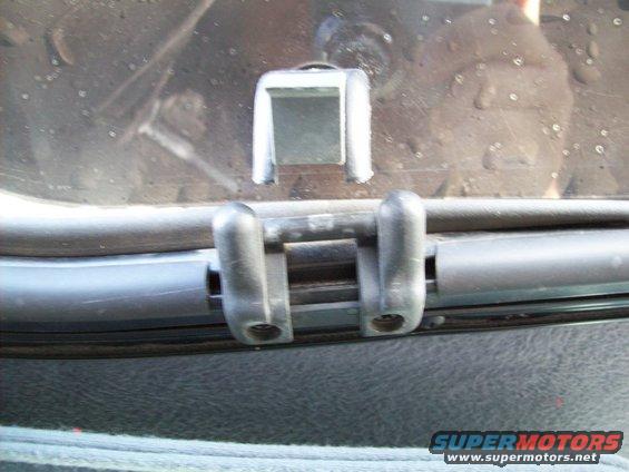 Close-up of a sunroof latch mechanism inside a vehicle