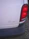 1997 Plymouth Voyager - Rear view of a 1997 Plymouth Voyager, showing the taillight and some faded badging on the body panel.