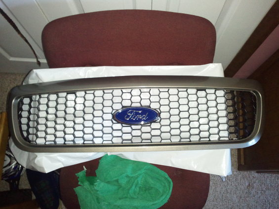 Ford oval emblem on a honeycomb grille