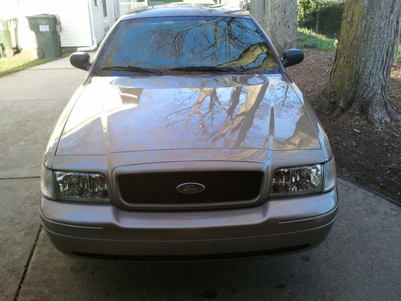 Tan 2007 Ford Crown Victoria front view with honeycomb grille