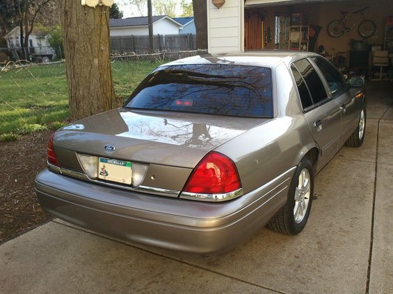 Tan 2007 Ford Crown Victoria rear view