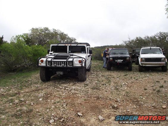 White Hummer H1 front view with brush guard and winch