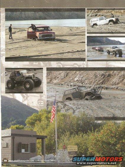 1978 Ford Bronco stuck in mud with an American flag nearby